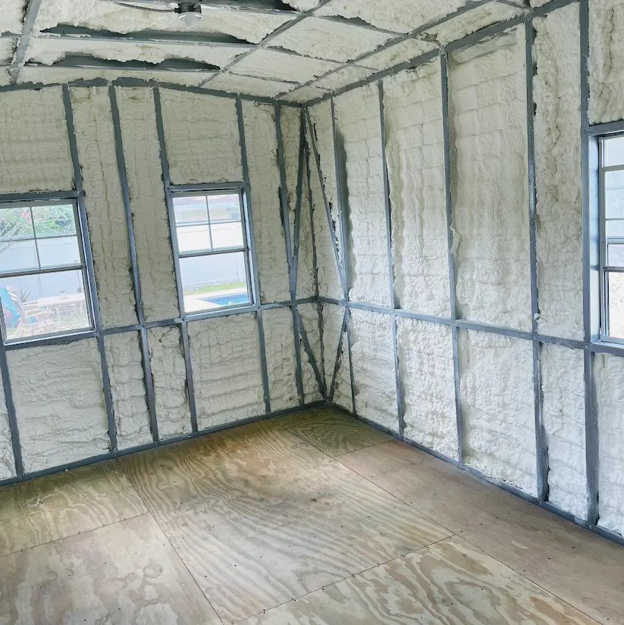 Closed-cell spray foam insulation applied to wall cavities in a residential project in Metuchen